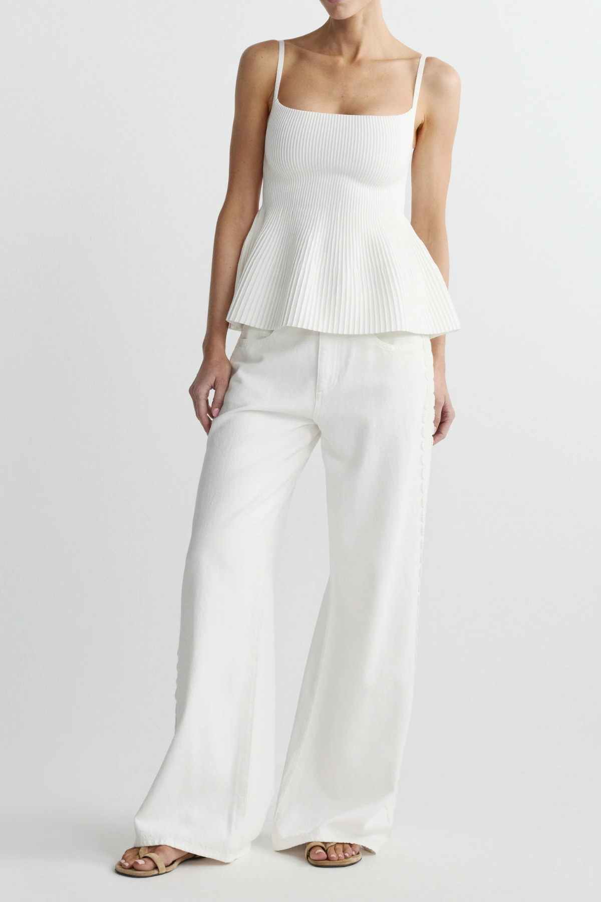 woman in white outfit on white background 