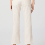 Person wearing white ribbed pants on a plain background