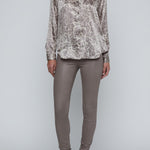 Long-sleeve blouse with a smooth, polished finish.