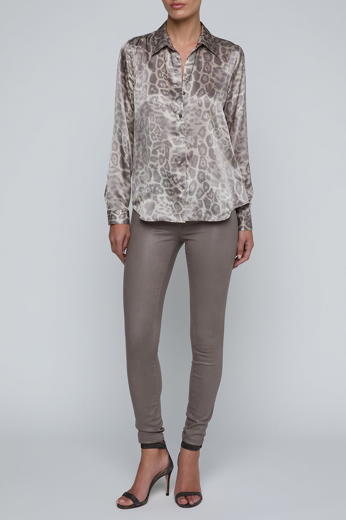 Long-sleeve blouse with a smooth, polished finish.
