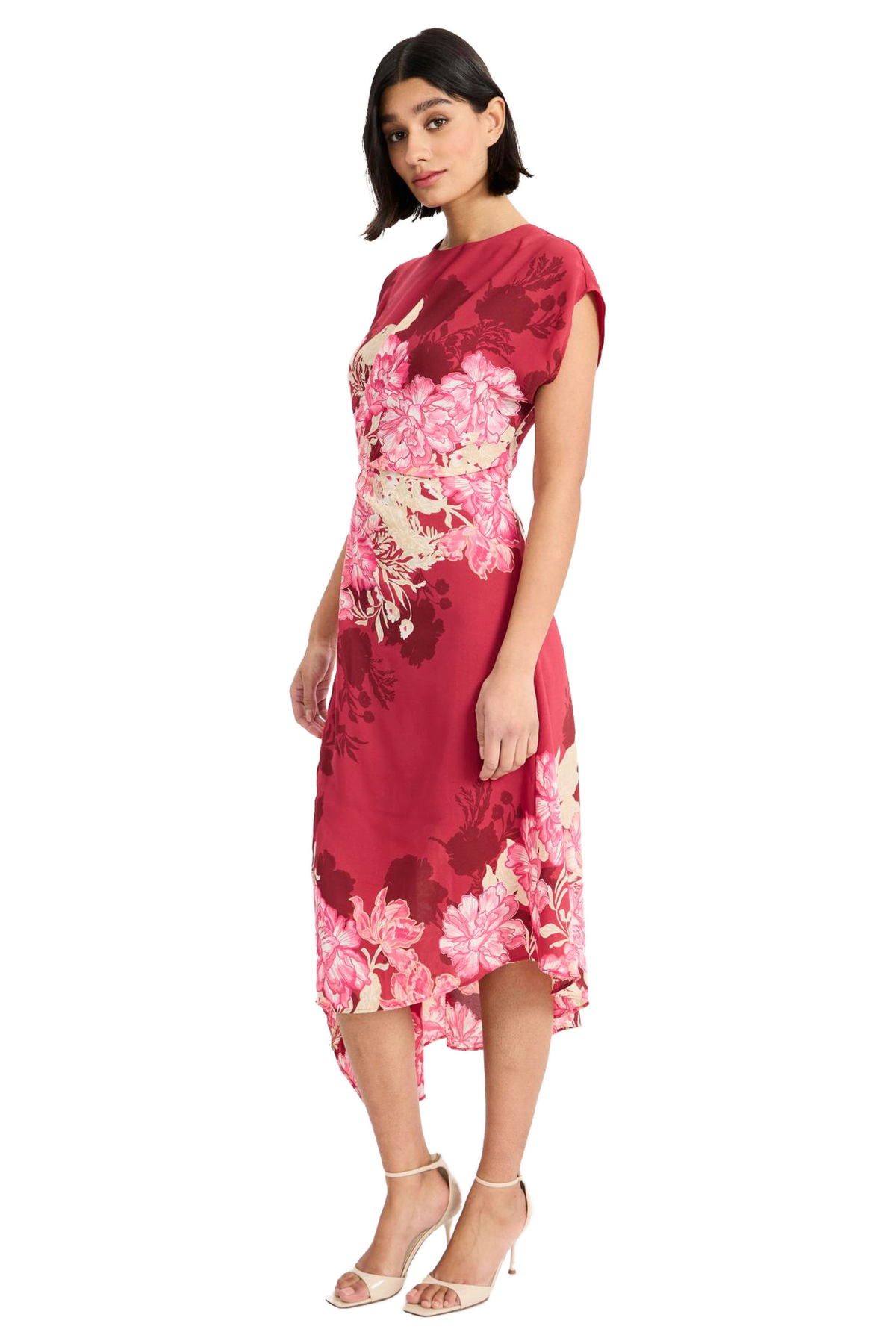 Model wearing a vibrant pink printed short-sleeve midi dress with an asymmetrical hem and flowing silhouette.