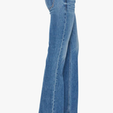 Blue jeans worn by a person on a white background