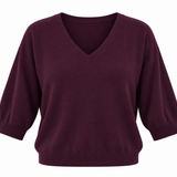 Women's burgundy V-neck knit top featuring three-quarter sleeves and a relaxed silhouette.