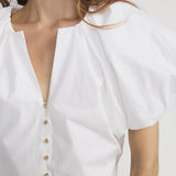 Blouse with dramatic voluminous sleeves styled with denim