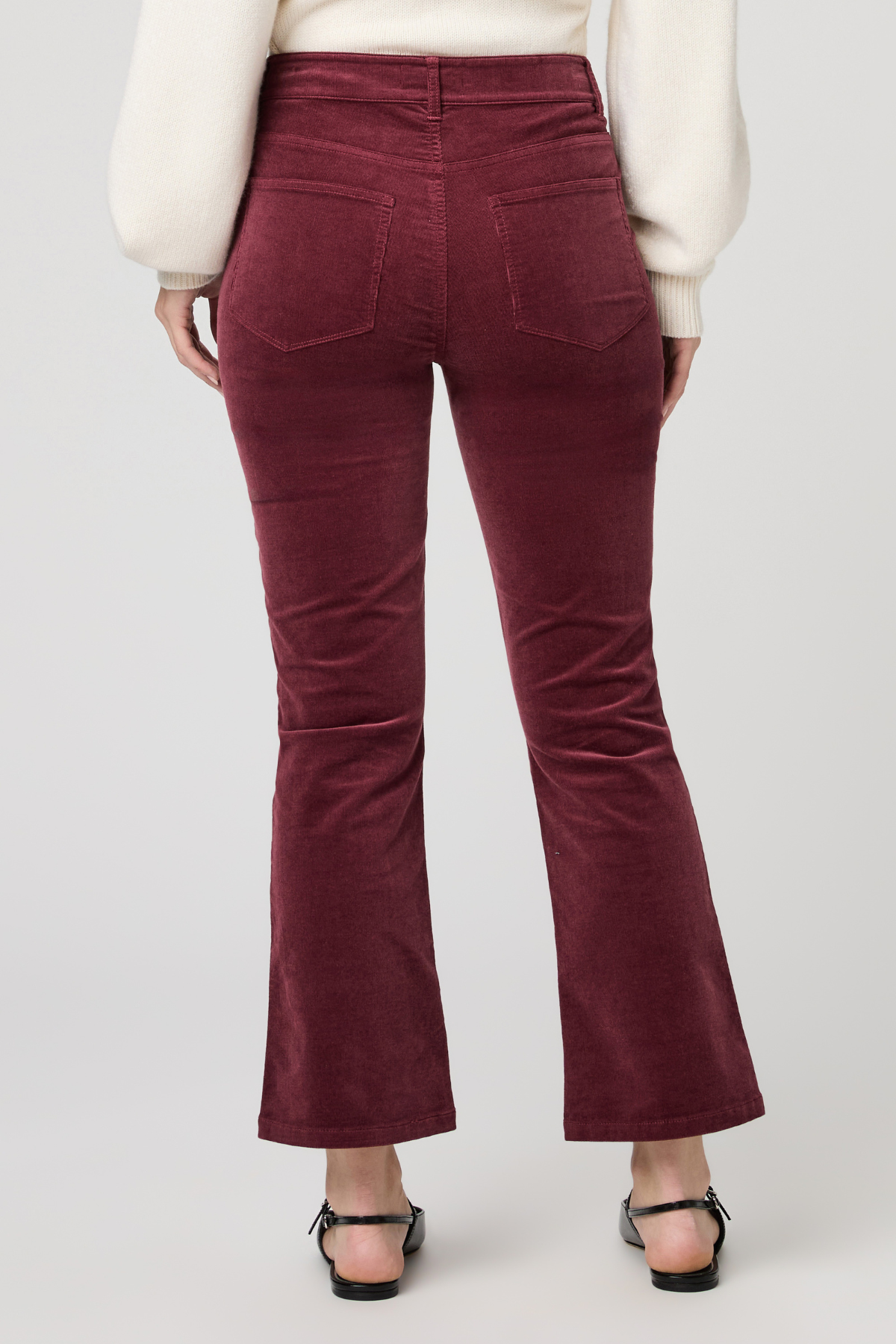 Women's pinot cropped bootcut jeans featuring a rich burgundy hue and flattering silhouette.