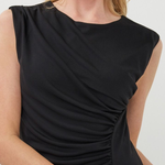 Black sleeveless dress worn by a model on a white background