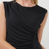 Black sleeveless dress worn by a model on a white background