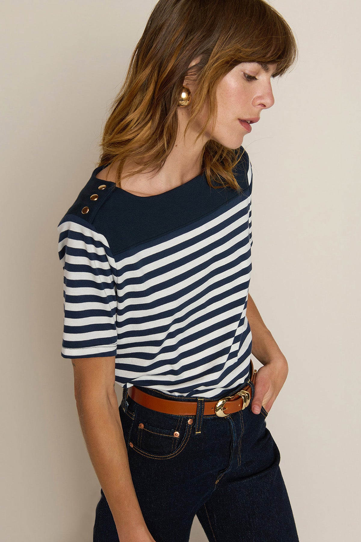 Striped short-sleeve tee with a relaxed fit, styled with denim