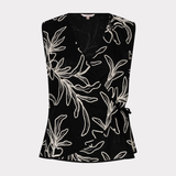 Black sleeveless top with white floral pattern on a white background
