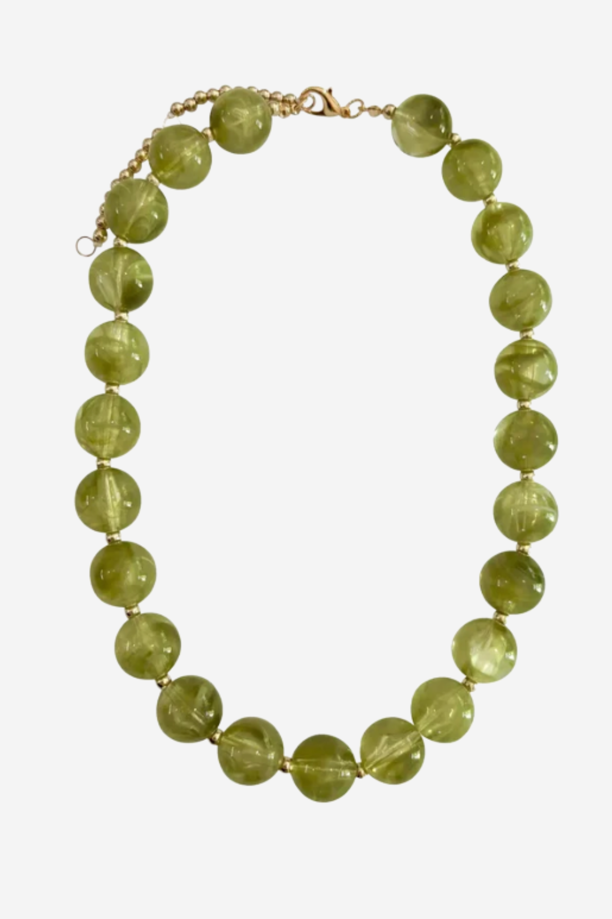 A beaded necklace made of faceted olive green glass beads separated by small gold spacers, with a gold chain extender and clasp, shown on a light gray background.