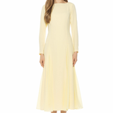 woman in butter yellow midi dress and long sleeves on white background 