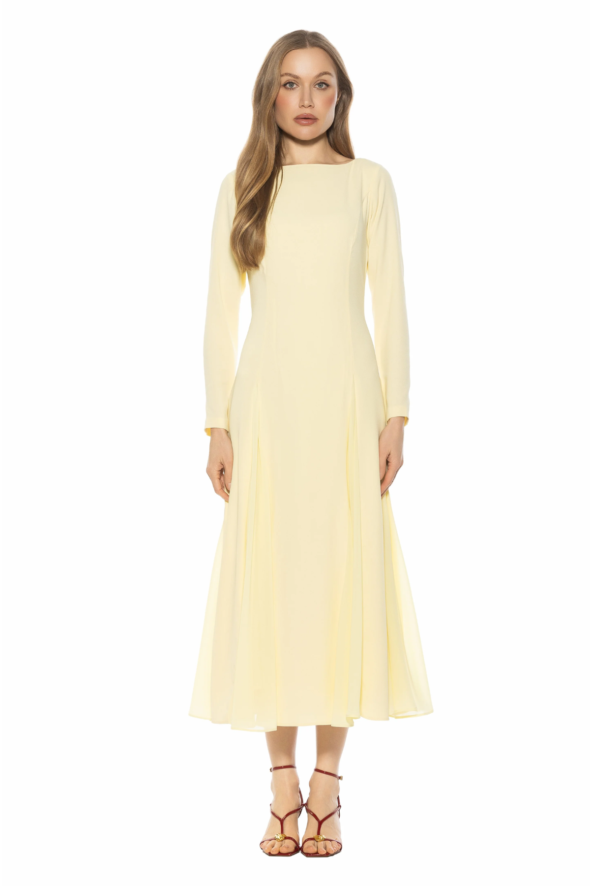 woman in butter yellow midi dress and long sleeves on white background 