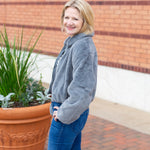 Faux fur zip-up jacket with a plush collar in a neutral tone