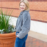 Faux fur zip-up jacket with a plush collar in a neutral tone