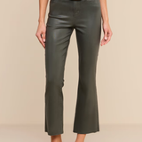 A model wearing dark olive green cropped flare pants with a black belt featuring a gold buckle, paired with a black top and black high heels, against a solid beige background.