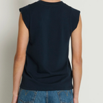Model wearing a navy sleeveless muscle tank with a relaxed fit.
