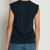Model wearing a navy sleeveless muscle tank with a relaxed fit.