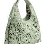 Mint green handbag with perforated design on a white background