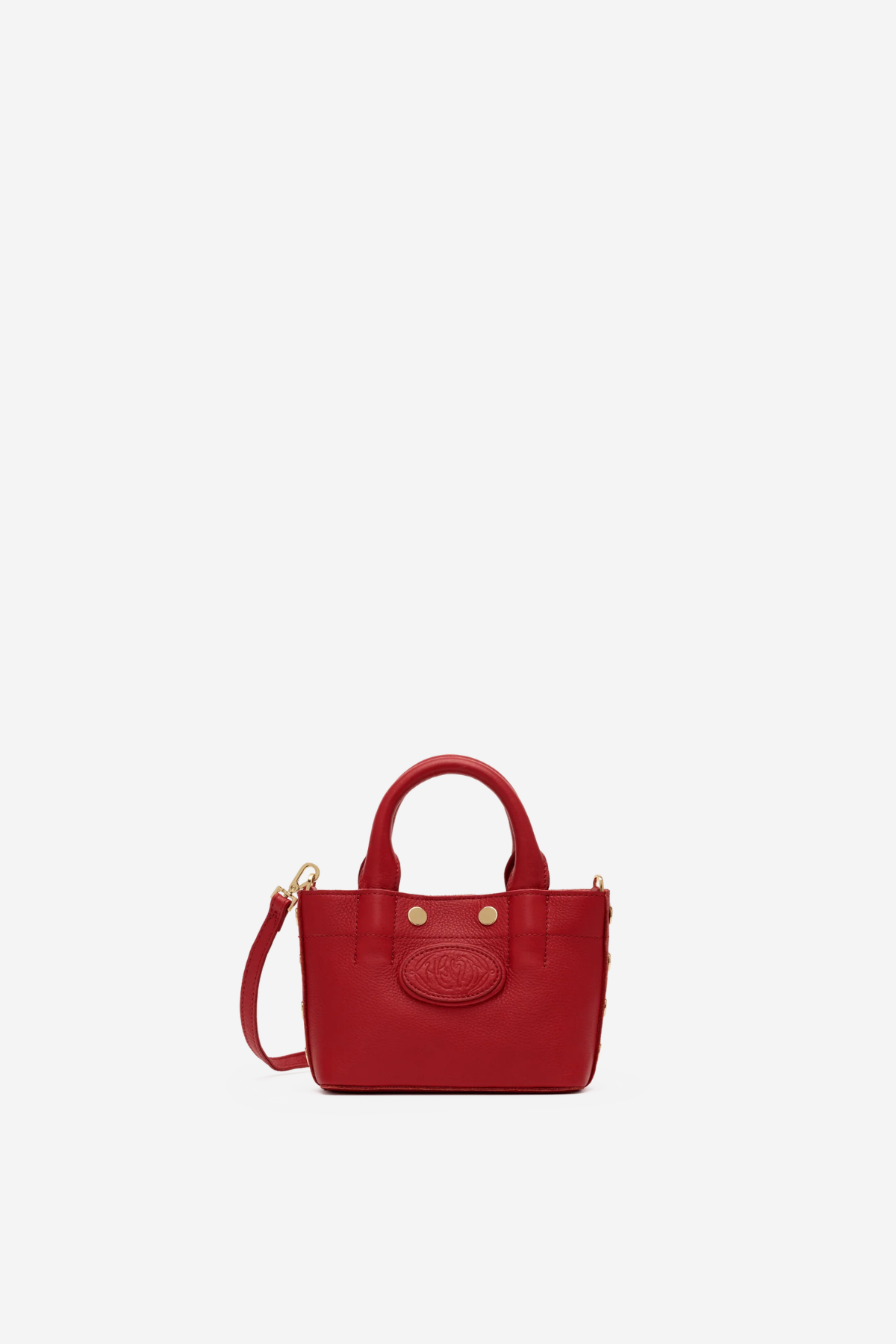 Small structured red tote bag with dual top handles and a compact, polished silhouette.