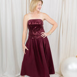 Burgundy sequin dress for evening wear paired with heels