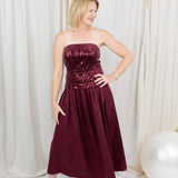 Burgundy sequin dress for evening wear paired with heels