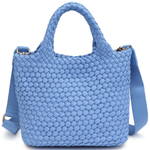 Blue woven handbag with a strap on a white background