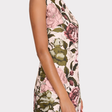 Floral patterned dress worn by a person on a white background
