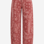 A pair of high-waisted, wide-leg cropped jeans in a washed dusty rose pink denim with a white paisley and floral bandana print, shown against a plain white background.