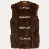 A dark brown faux fur vest with four brown leather toggle closures featuring gold-tone metal buckles, shown flat on a light beige background.