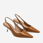 A pair of pointed-toe slingback pumps in glossy tan patent leather with gold-tone heels, displayed on a light gray background.