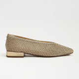 Beige woven flat shoe on a light gray background
