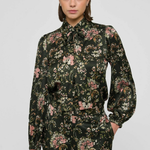 Women's printed style featuring an earthy multicolor pattern and feminine silhouette.