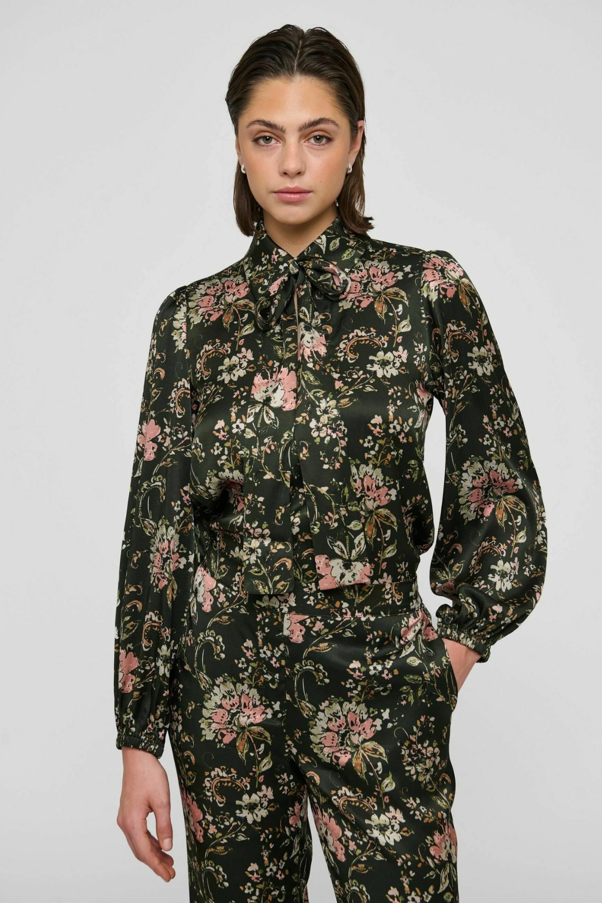 Women's printed style featuring an earthy multicolor pattern and feminine silhouette.