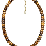 A beaded necklace made of polished tiger's eye beads in brown and golden-brown tones, with a gold-tone clasp and extender chain, shown on a plain white background.
