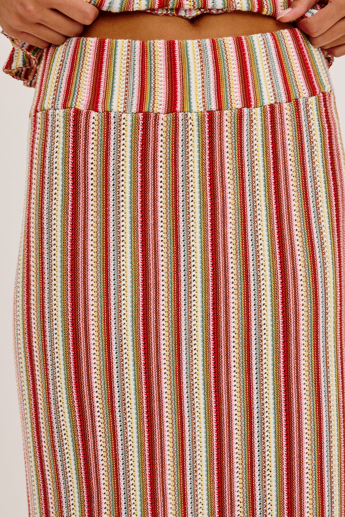 Multicolored striped skirt with a plain background