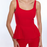 Red peplum top and pants on a white background