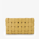 Yellow woven clutch bag on a white background