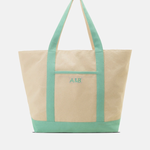 Two-toned tote bag with green top half and beige bottom half on a white background