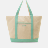 Two-toned tote bag with green top half and beige bottom half on a white background