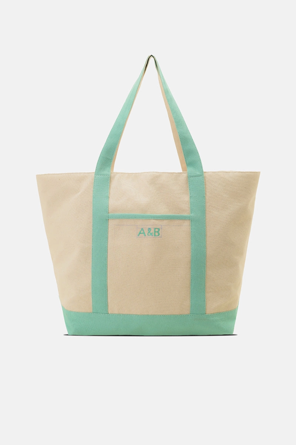 Two-toned tote bag with green top half and beige bottom half on a white background
