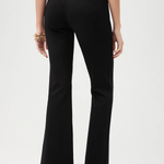 Black pants worn by a person on a white background
