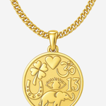 A gold-toned chain necklace with a round medallion pendant featuring embossed symbols and the number 13, shown on a light gray background.