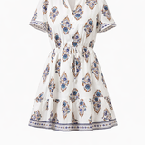 White dress with blue and red pattern on a white background