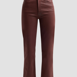 A pair of high-waisted, straight-leg jeans in a deep burgundy brown, shown against a solid light gray background.
