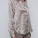 Long-sleeve blouse with a smooth, polished finish.