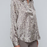 Long-sleeve blouse with a smooth, polished finish.