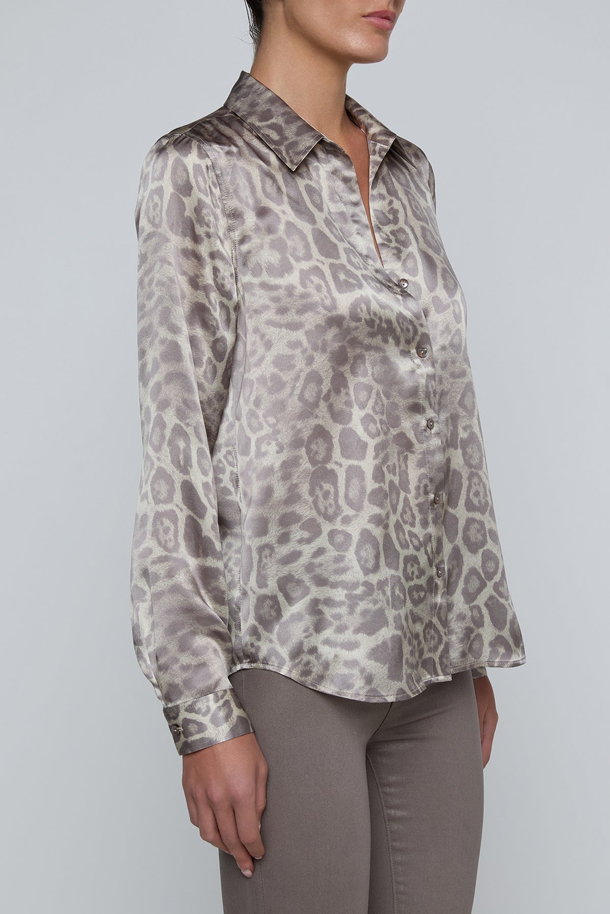 Long-sleeve blouse with a smooth, polished finish.