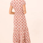 Printed midi dress with a flowing silhouette, styled for everyday wear.