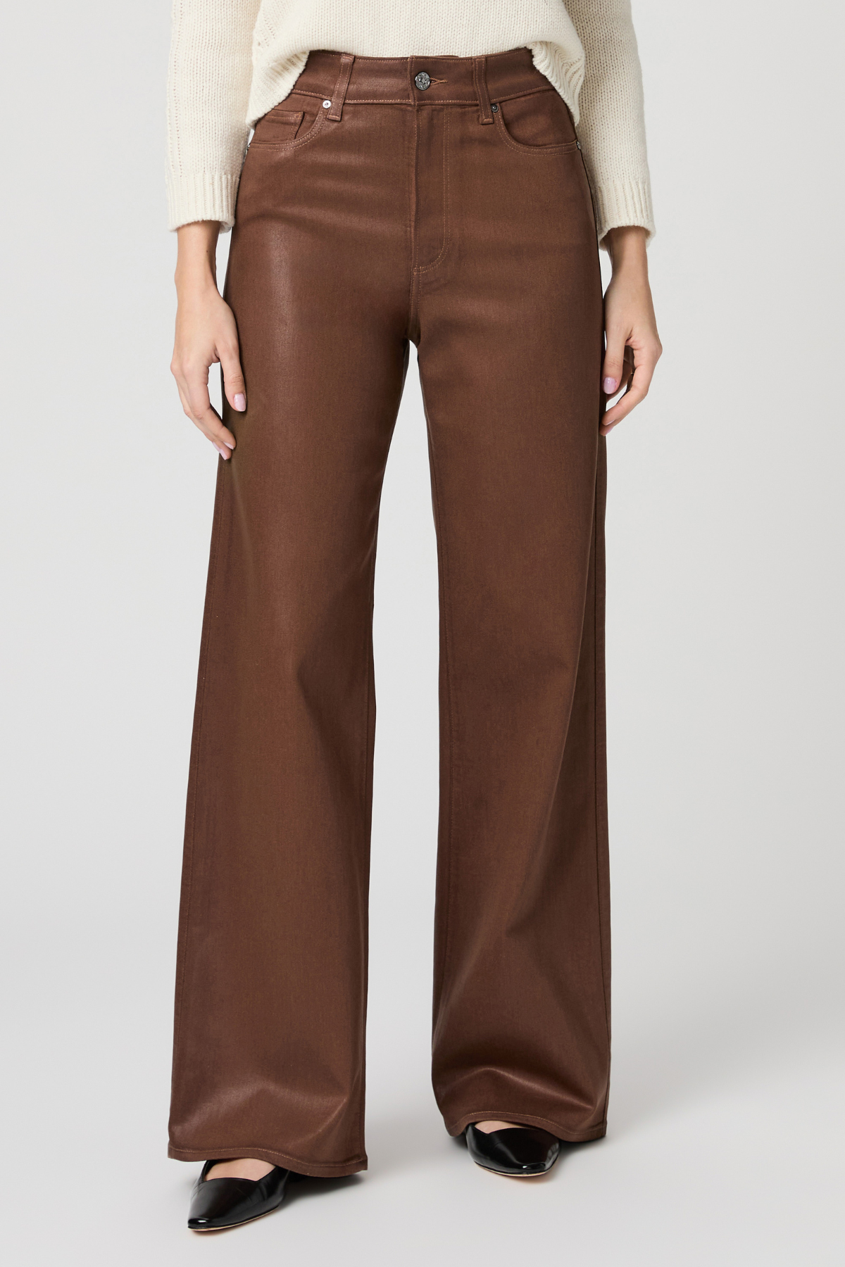 Women's cognac coated Anessa jeans featuring a high rise, 31-inch inseam, and wide-leg silhouette.