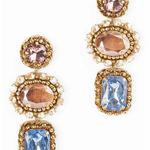 Gold and multi color rhinestone drop earrings on a white background.